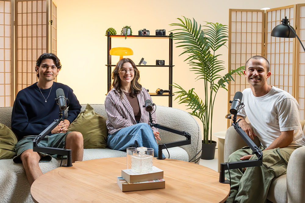 Image of the A Different Lens podcast hosts Wil Calabio and Kate Cornish with their guest on the recording studio