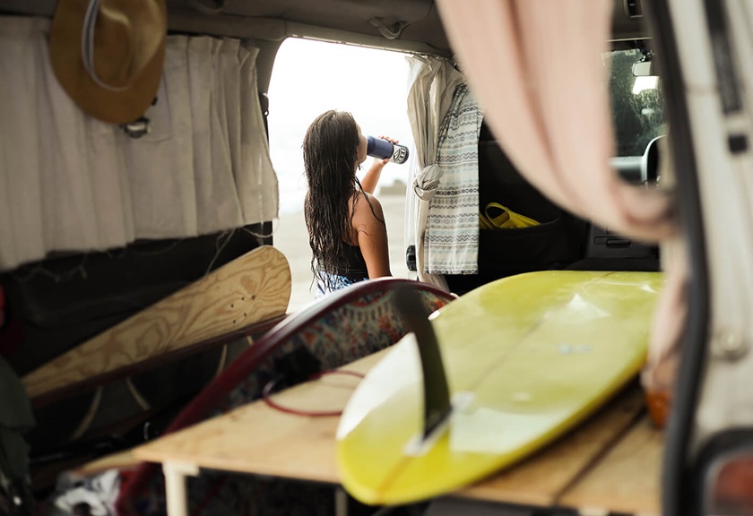 Photograph of girl drinking water outside her van using RF 50mm f/1.2 L USM