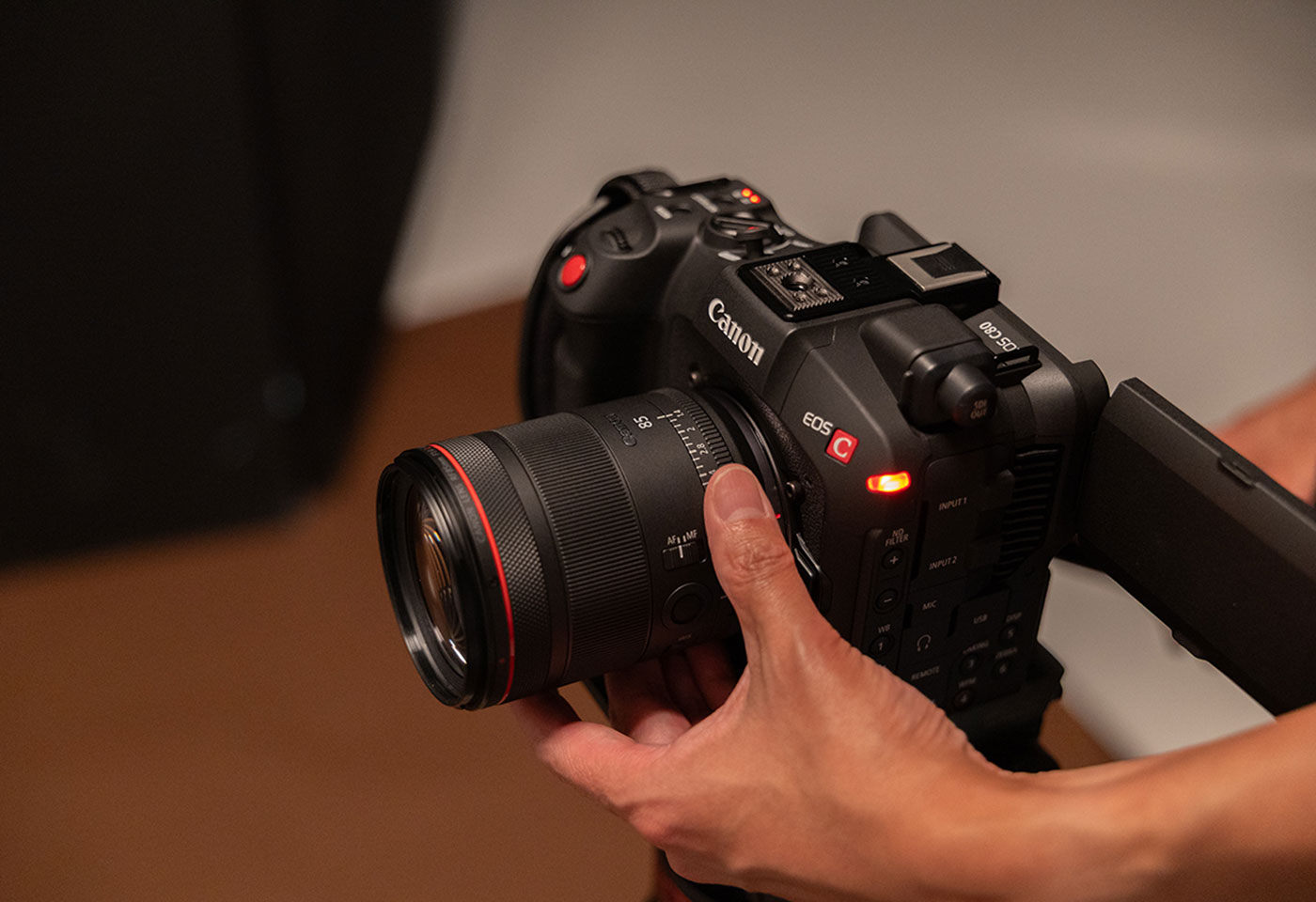 Image of a Canon cinema camera with the RF 85mm f/1.4L VCM lens attached