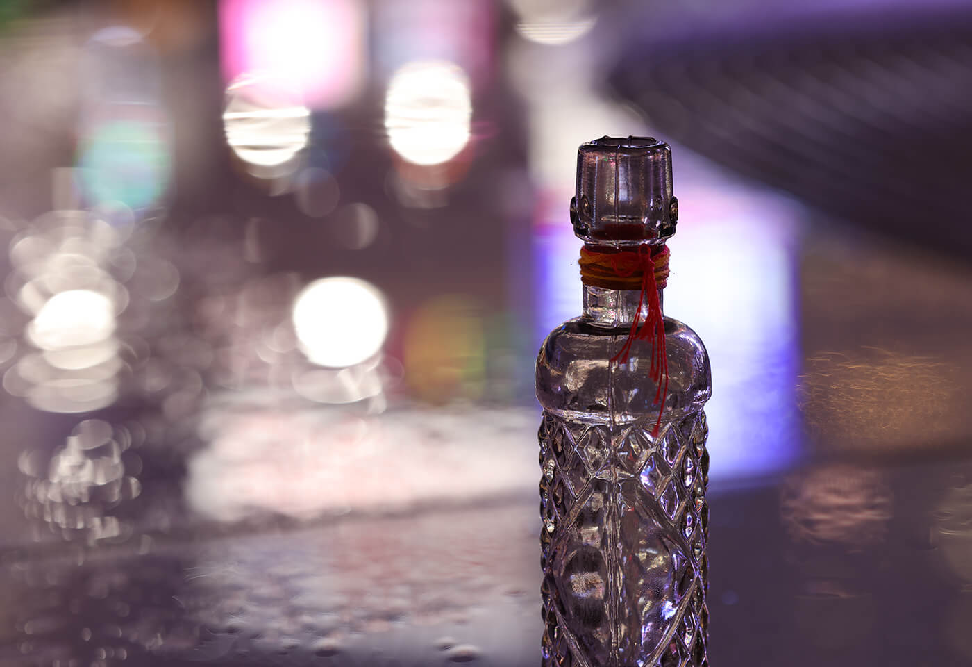 Bokeh image of bottle taken with RF 100mm f/2.8L Macro IS USM macro lens