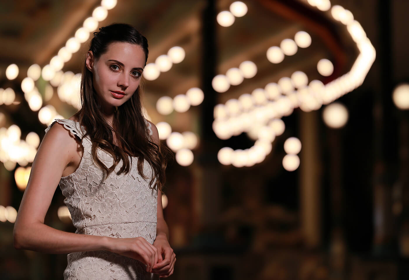 Model in front of carousel taken using RF 85mm f/1.2L USM DS prime lens
