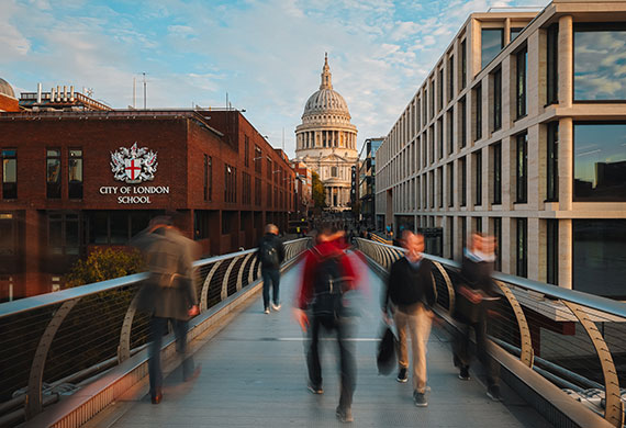 Long exposure image of a bridge with people walking